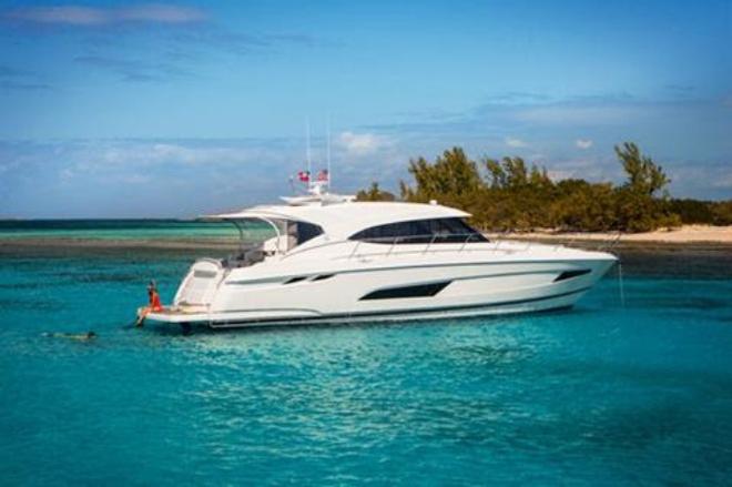 The 5400 Sport Yacht's confident poise is complemented by sleek lines and practical design considerations, including her wide, hydraulic swim platform and large tender garage © Riviera Australia